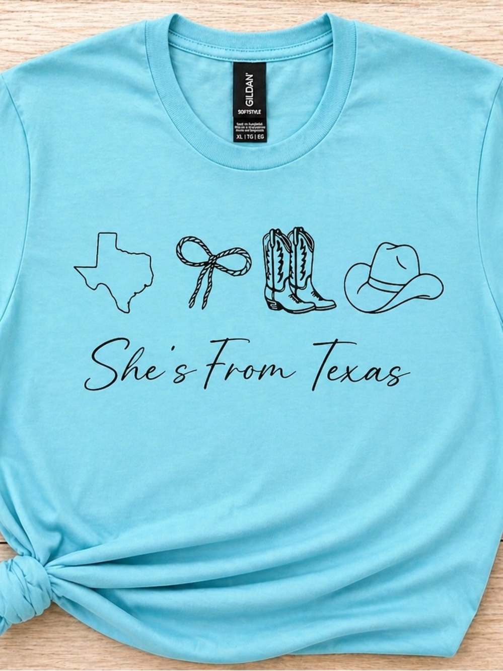 Gildan Light Blue Softstyle Crewneck Tee” She’s from Texas”